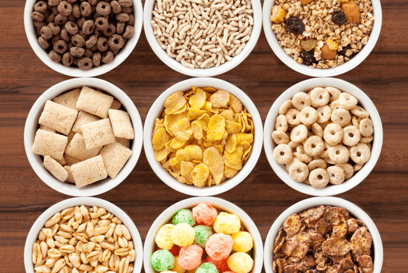 top down view of a variety of breakfast cereals in small bowls