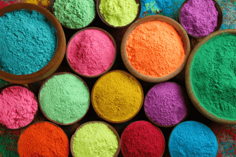 top down view of a bunch food dye powders in bowls