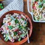 top down view of healthy BLT pasta salad in wooden bowl