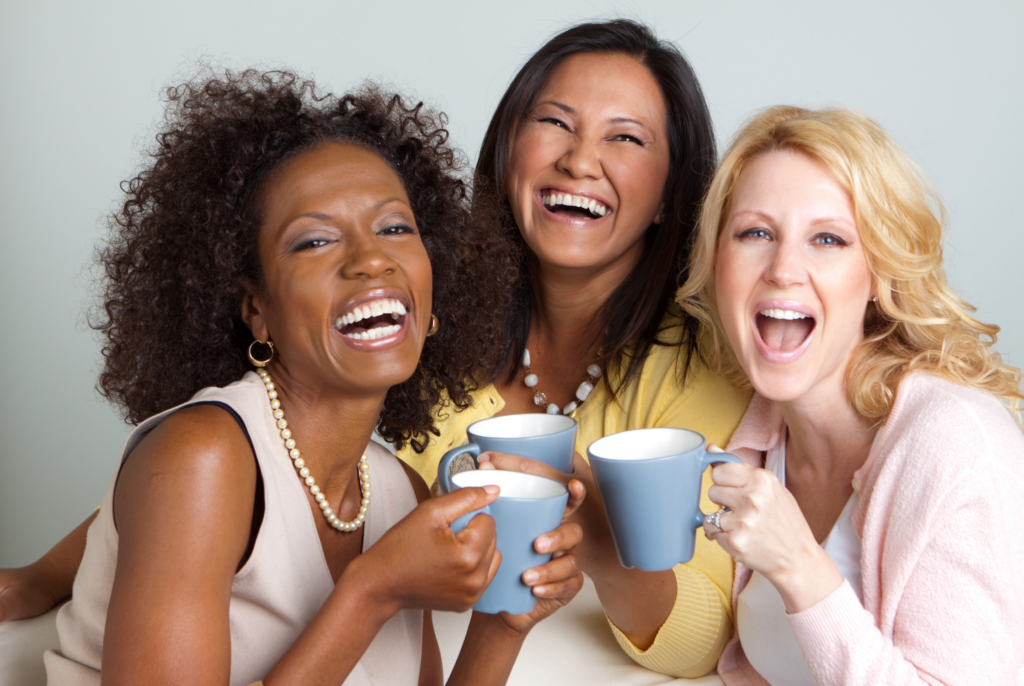 three happy women smiling together because they have the right perimenopause diet support