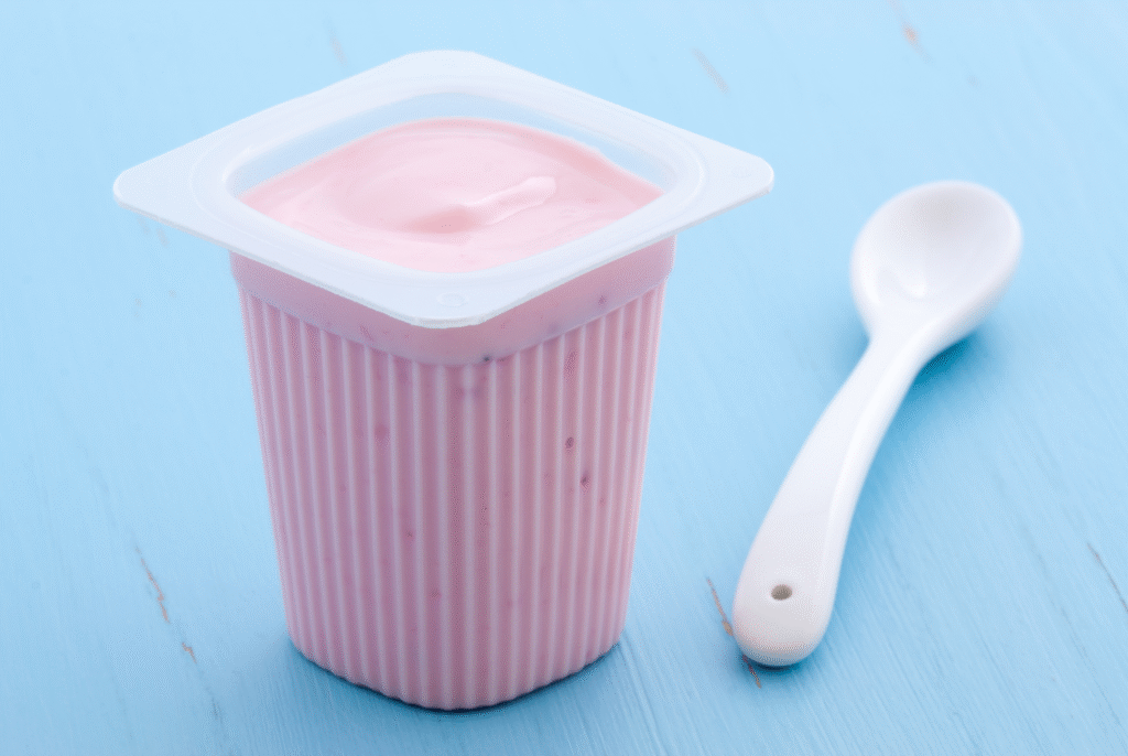 close up of a container of yogurt which is a processed food for kids