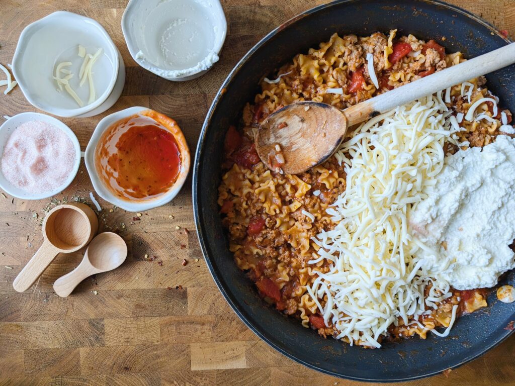 top down view of cheese added to skillet lasagna