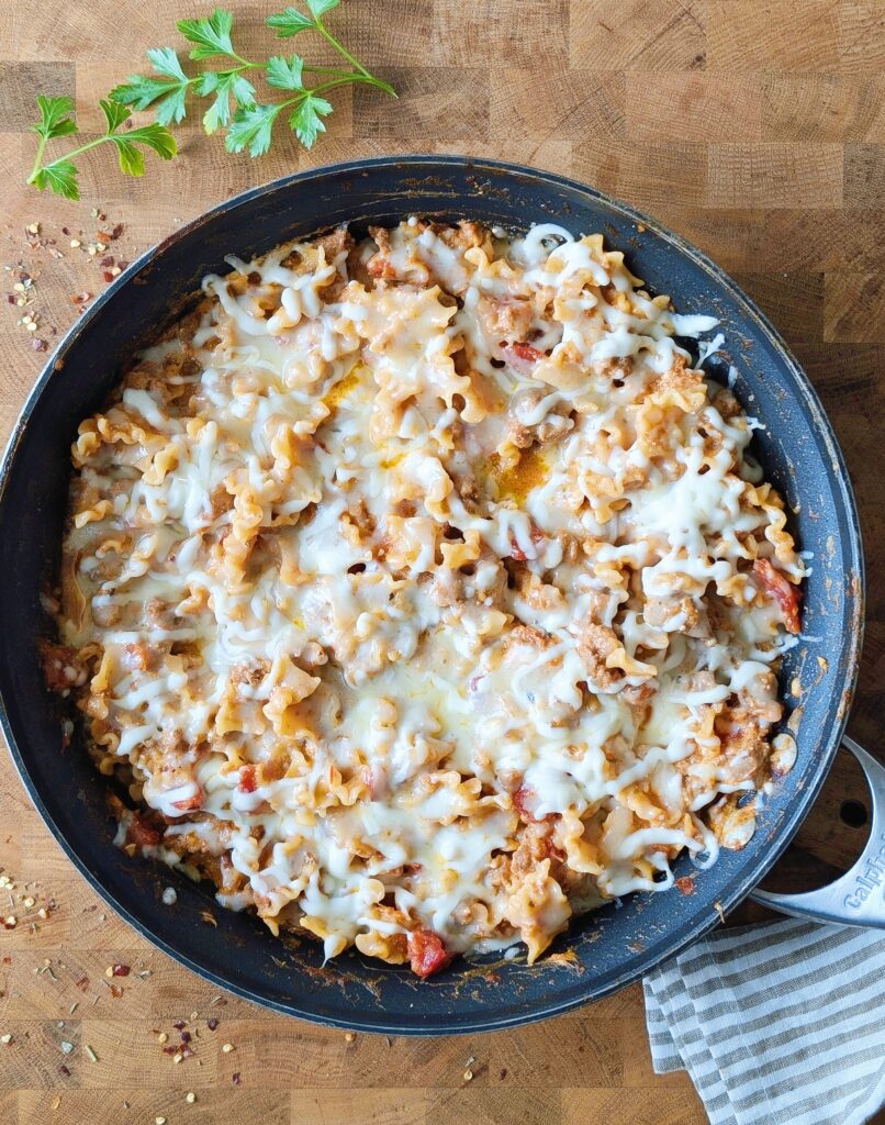 cheesy skillet lasagna with cheese on top
