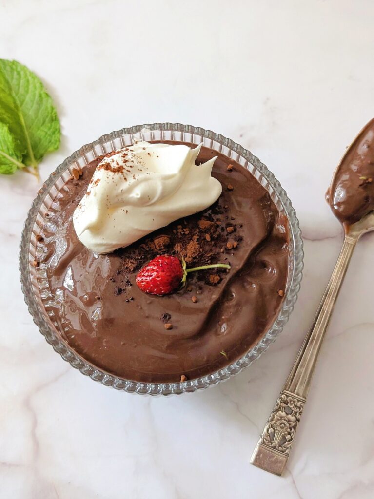 close up of one chocolate pudding in a glass dish