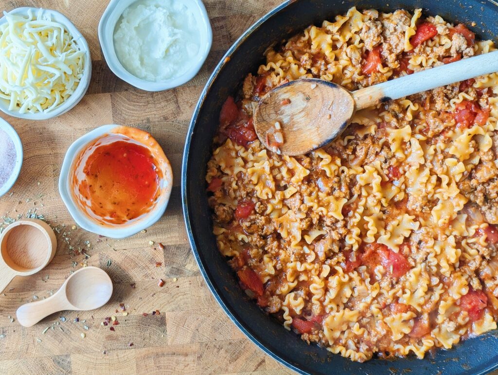 tomato sauce in skillet with pasta