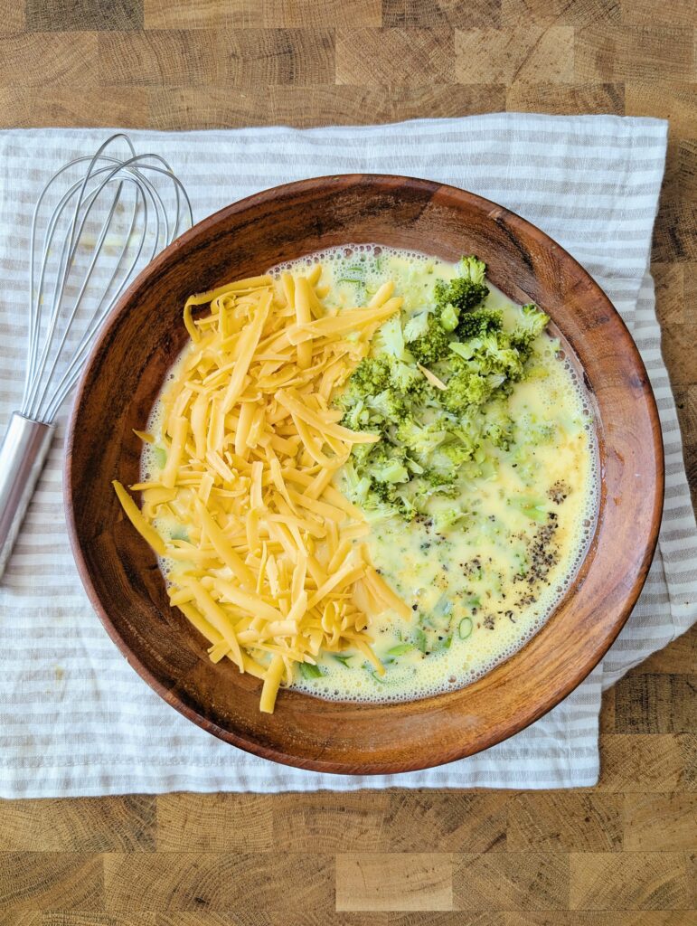 Fold in the broccoli and shredded cheese until just combined.