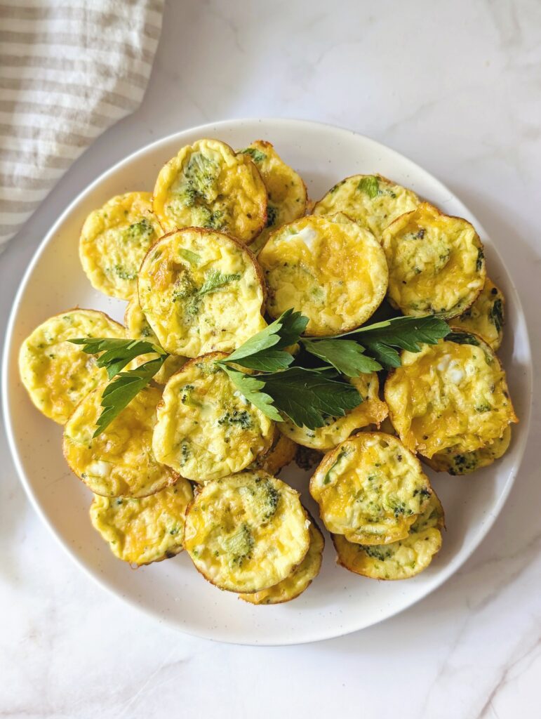 top down of frittata puffs on a plate with herbs