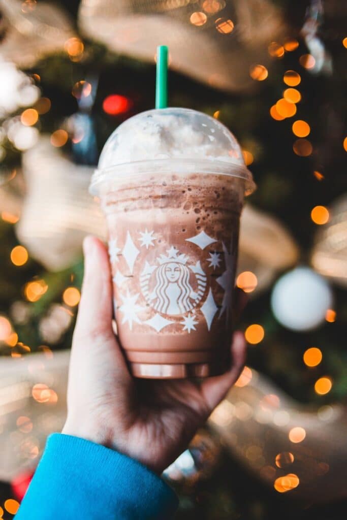 hand holding Starbucks holiday drink