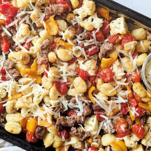 close up of sheet-pan gnocchi with sausage on a baking sheet