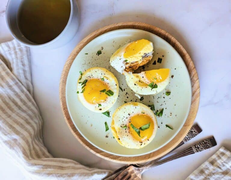 beauty shot of baked egg muffin cups with a side of coffee on a plate