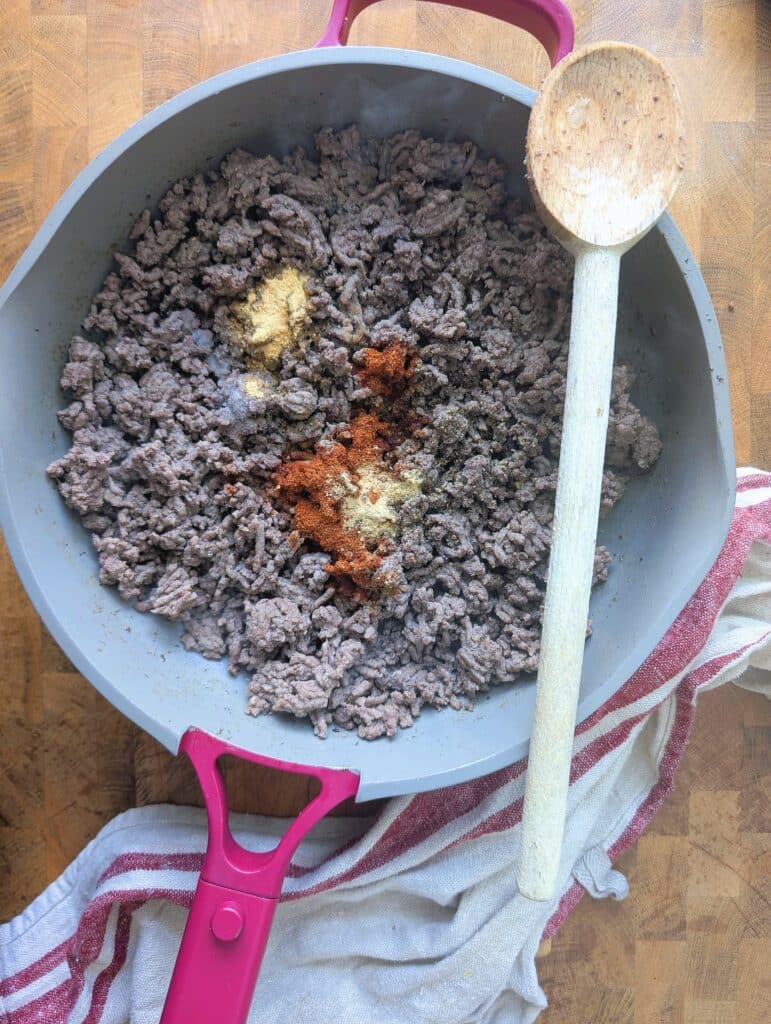 ground beef being cooked in a skillet