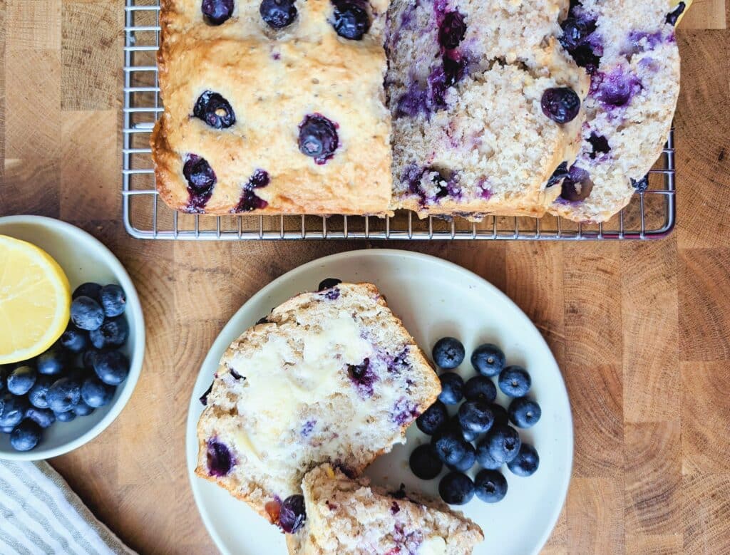 top down view of a slice of lemon blueberry snacking loaf