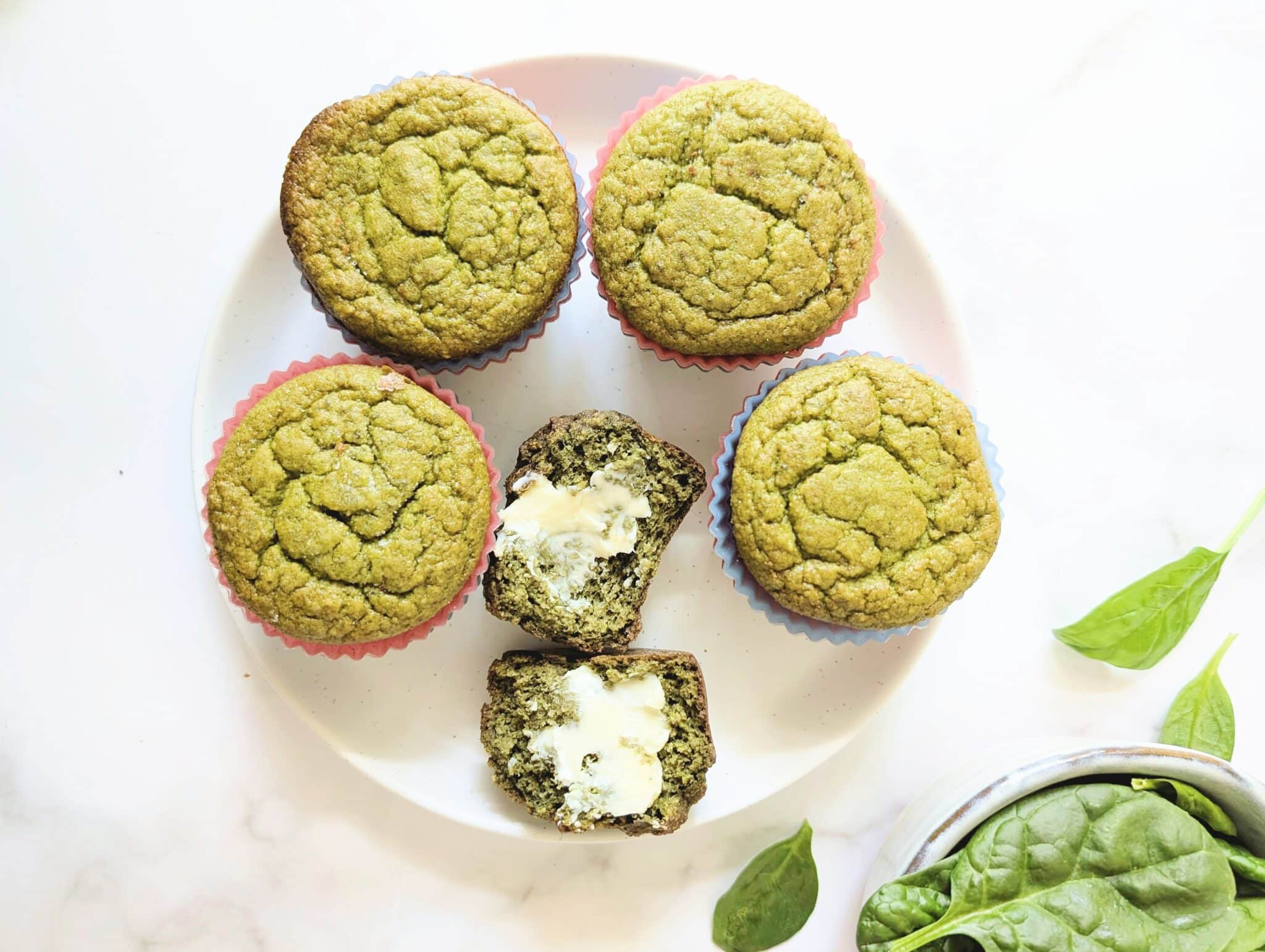 top down view of banana spinach blender muffins on a plate