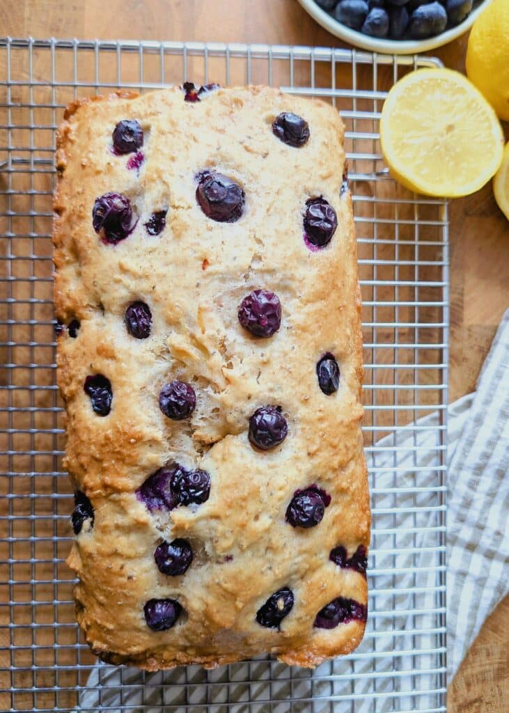lemon blueberry loaf on a cooling rack