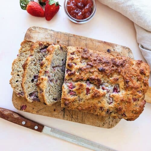 top down view of strawberry yogurt loaf for kids in slices resting on a cutting board