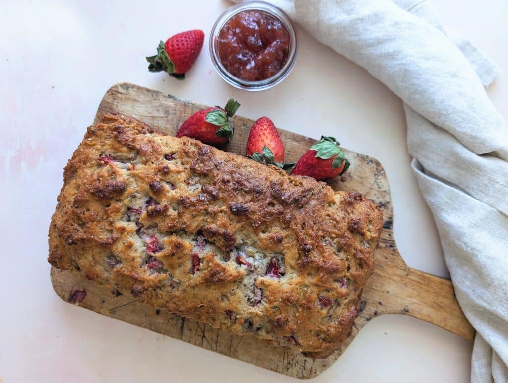 top down view of strawberry yogurt loaf on a cutting board