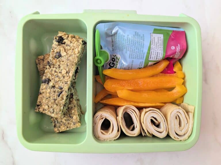 top down view of dark chocolate cherry granola bars in school lunch box