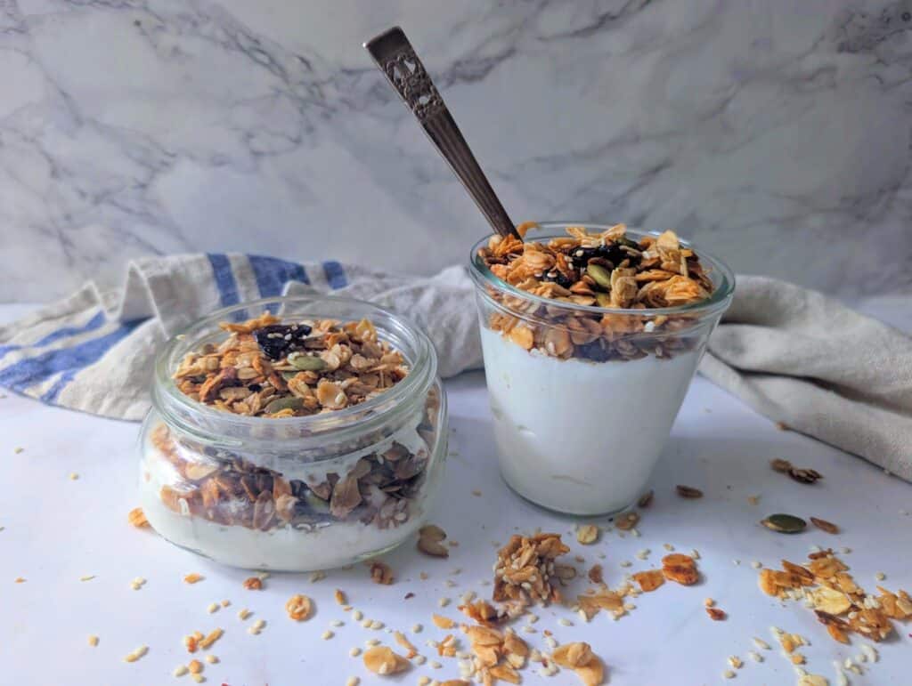 nut free air fryer granola over yogurt in bowls