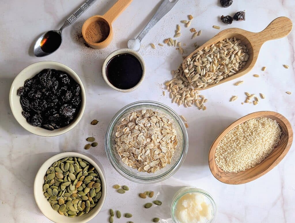 top down view of ingredients needed to make air fryer granola including oats, seeds