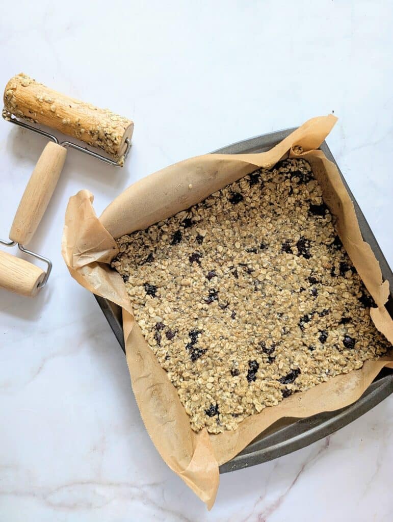 granola bar mixture pressed into a pan