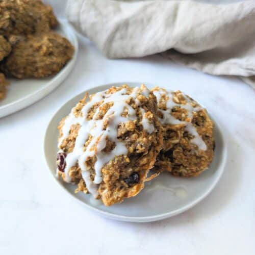 close up of carrot cake cookies with a drizzle