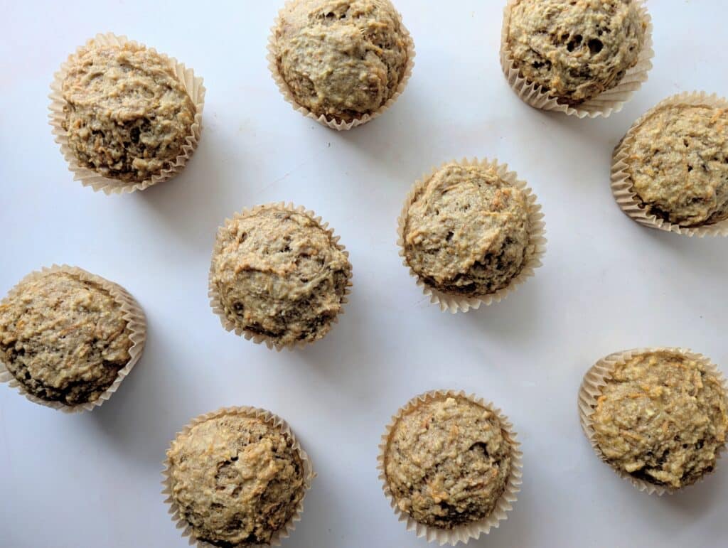 apple banana carrot muffins on a marble slab