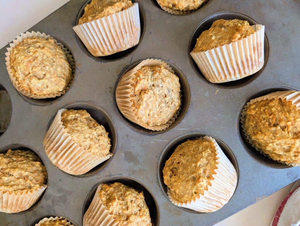 top down view of muffins fresh out of the oven cooling in muffin tins