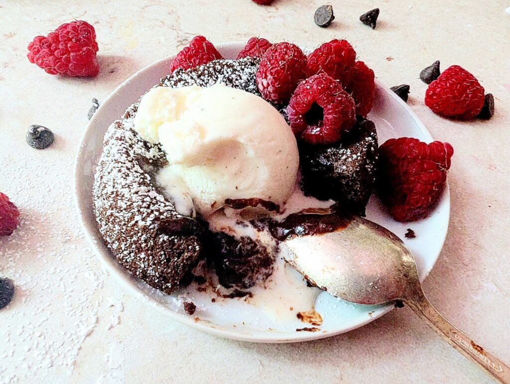 close up of lava cake ooey gooey on a plate